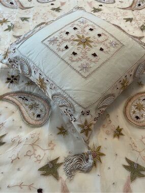 Beaded silk throw and matching pillow.
NWOT.